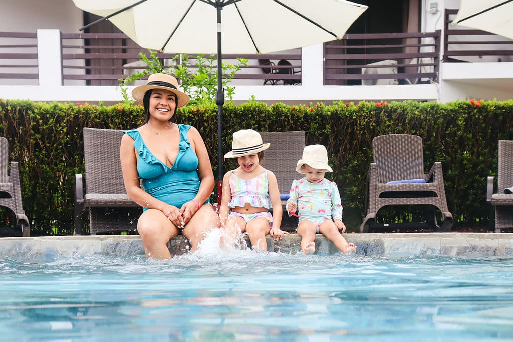 Family enjoying time by the pool