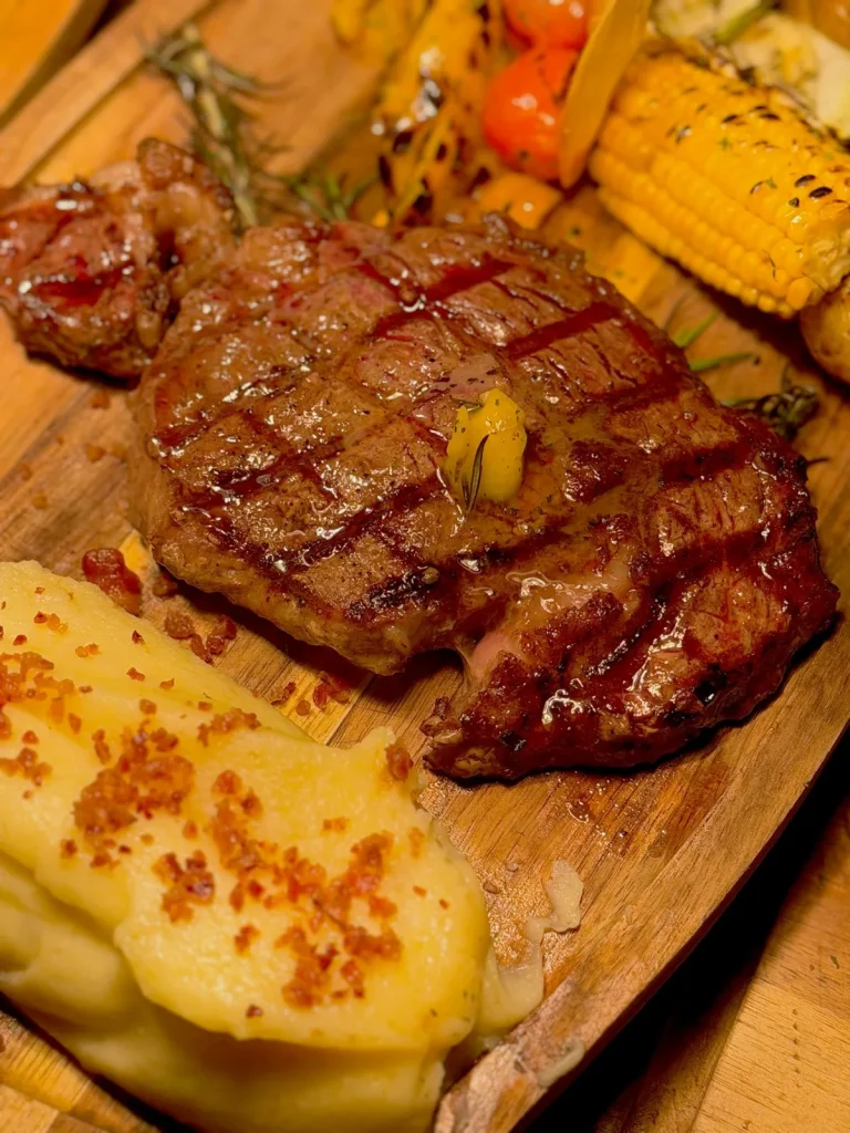 Grilled ribeye with mashed potato and chimichurri