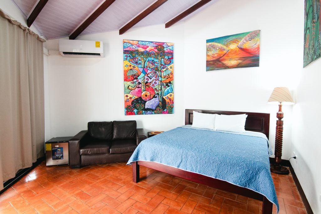 Junior Suite with a king bed and Costa Rican art